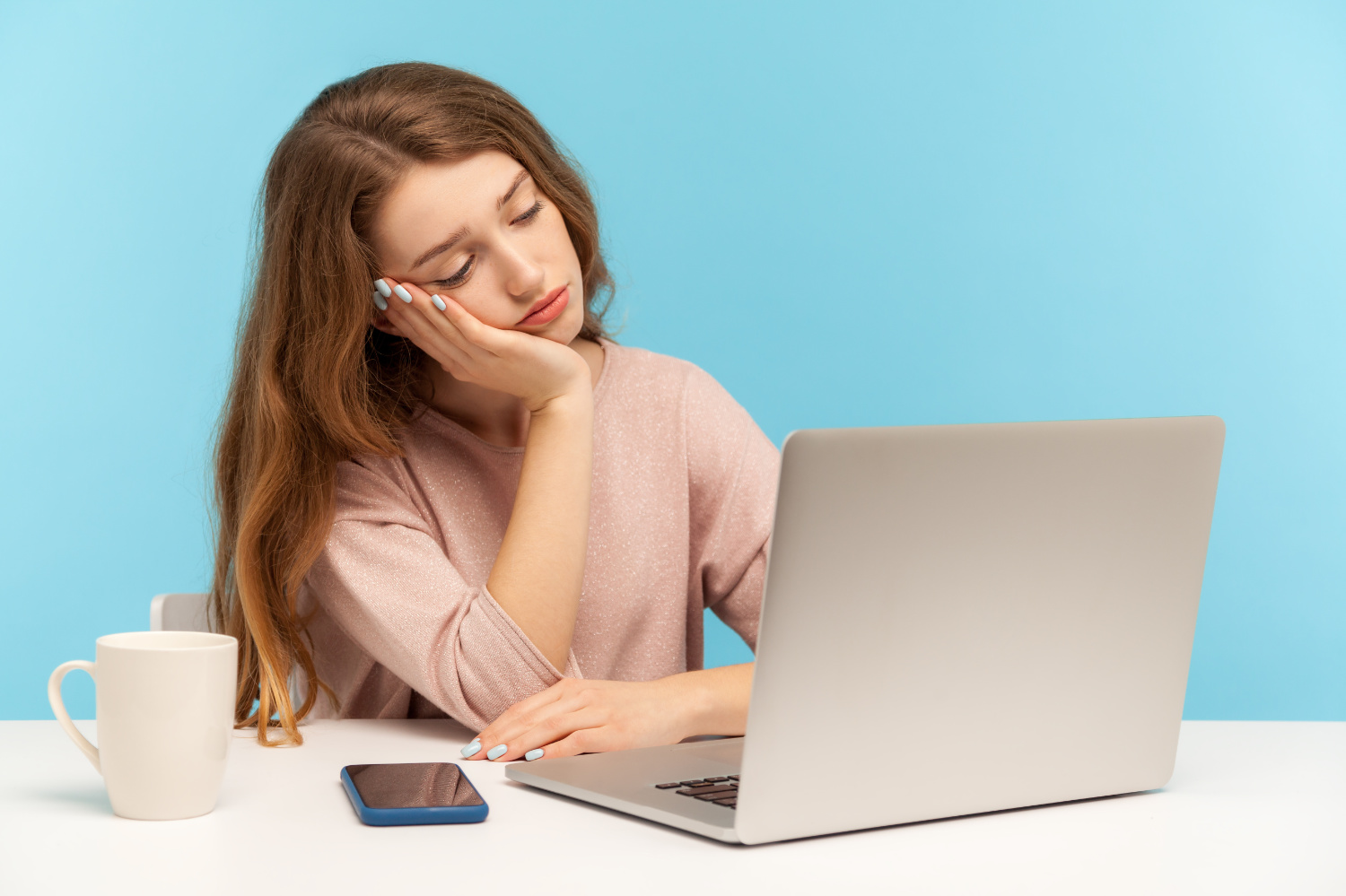 bored person in front of laptop